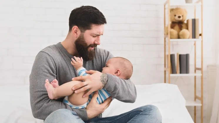 a man holding his baby